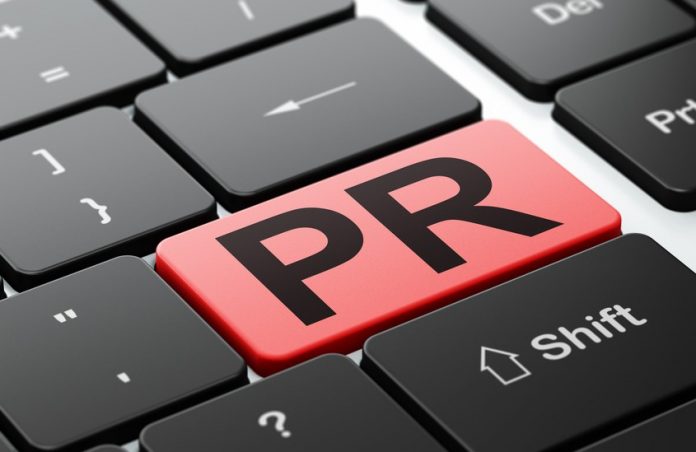 Advertising concept: PR on computer keyboard background